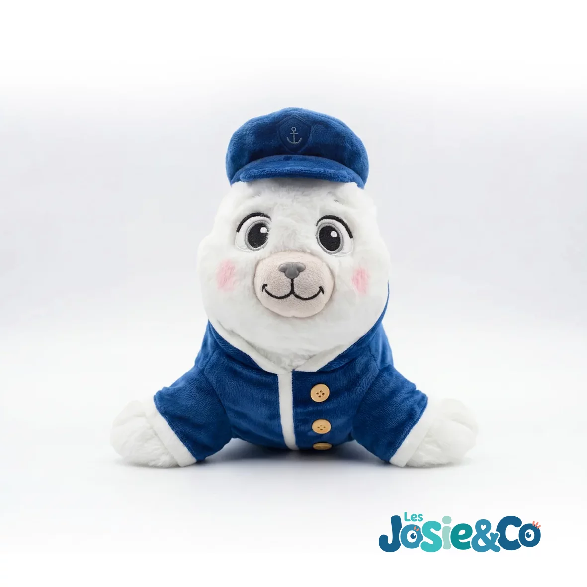 Peluche La Ptite Annick de face, museau rose et casquette de marin brodée d'une ancre